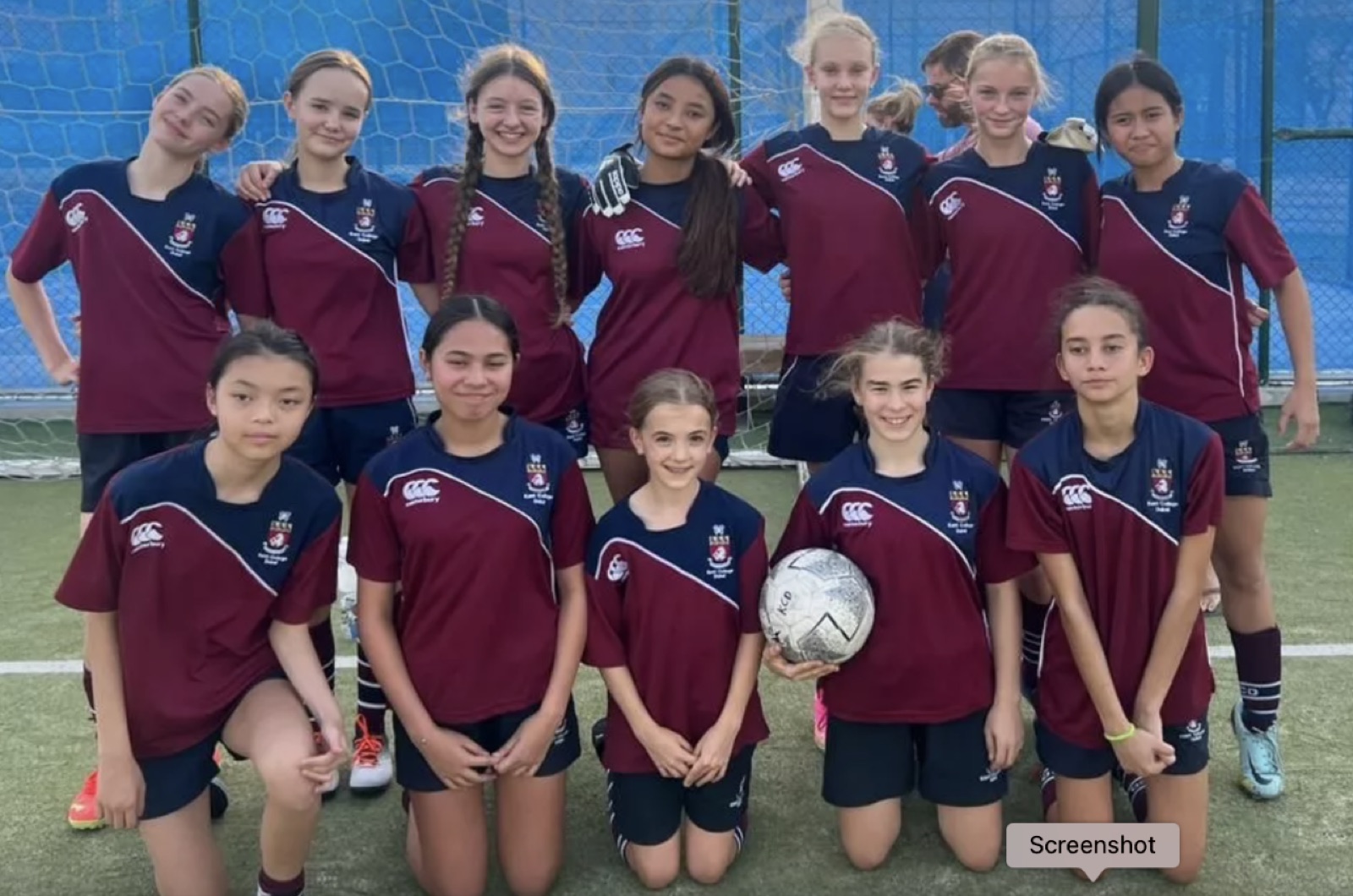 Kent College Dubai U14 girls' football team in maroon kits