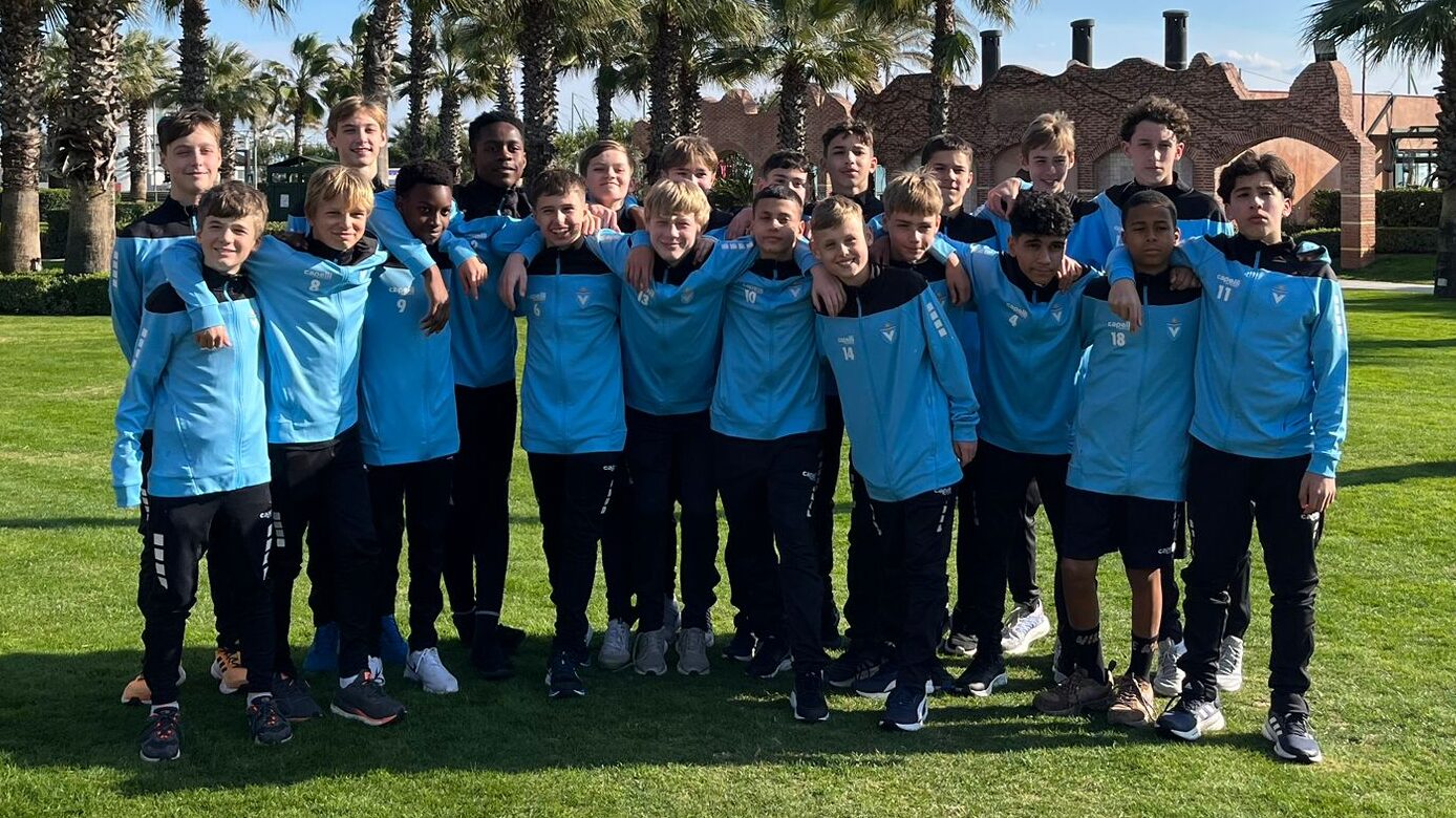 Viktoria Berlin youth team in blue tracksuits at an international tournament